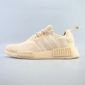 running in a softball field area shoes ADIDAS NMD_R1