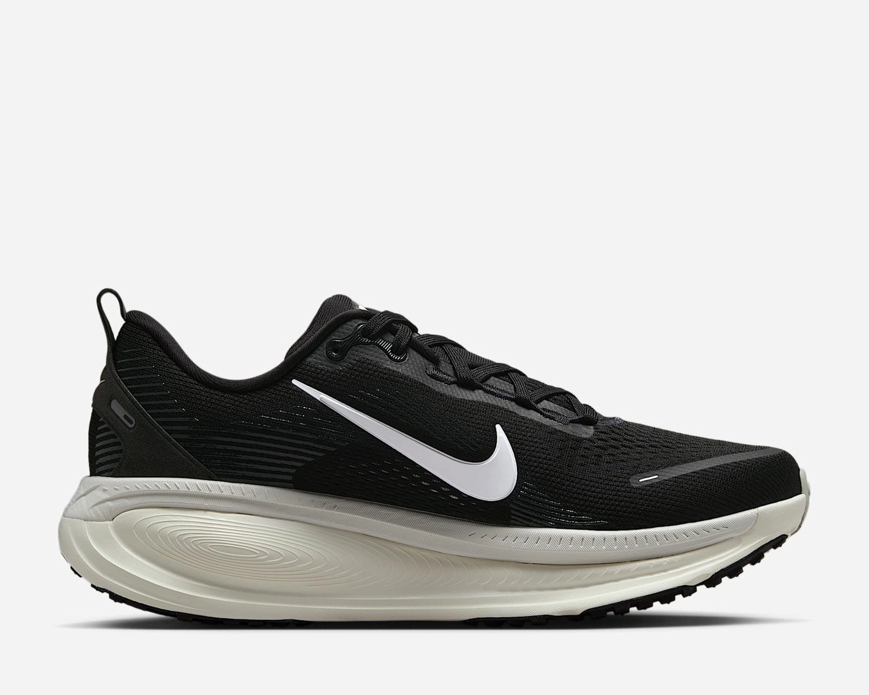 Air Zoom Vomero 18 Adaptive Comfort running in a ferry terminal area shoes
