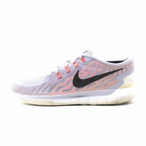 NIKE FREE RUN 5.0 running on an outdoor track shoes