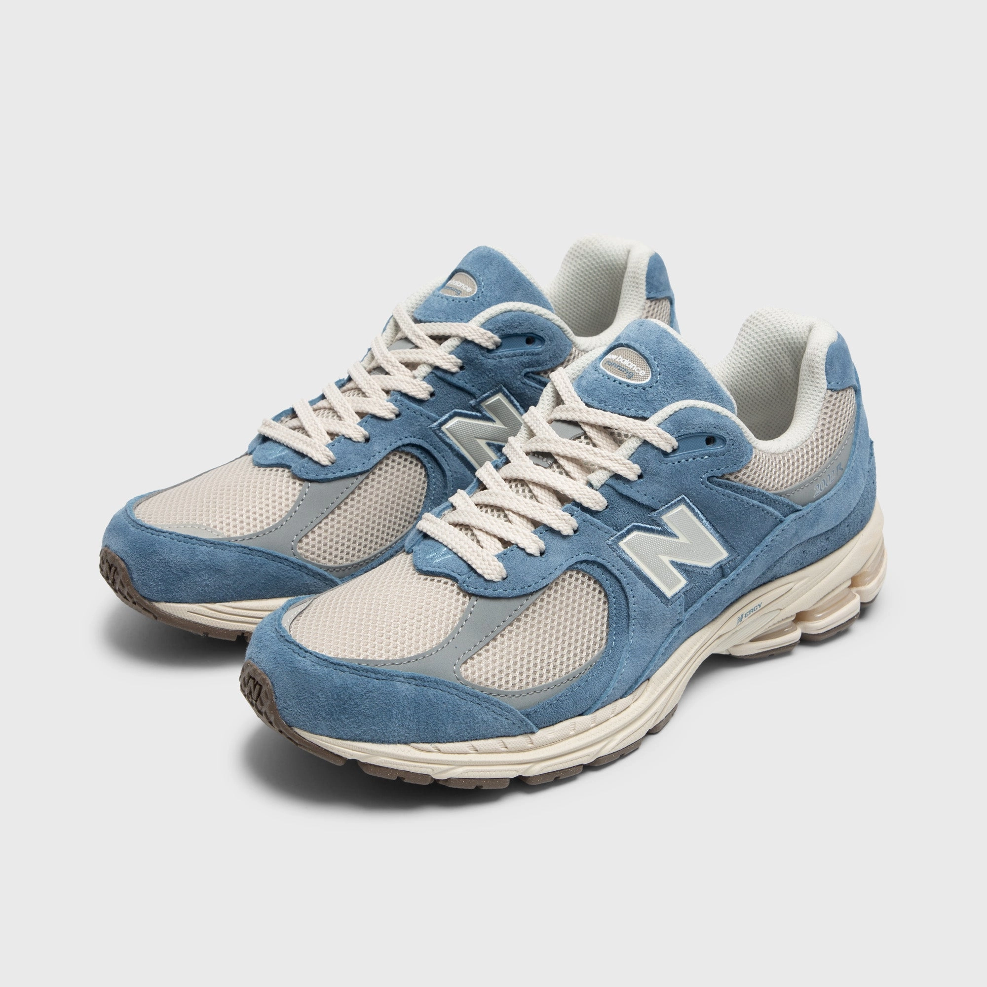 New Balance 2002R Shoreline / Blue running in a group shoes running in bright colors
