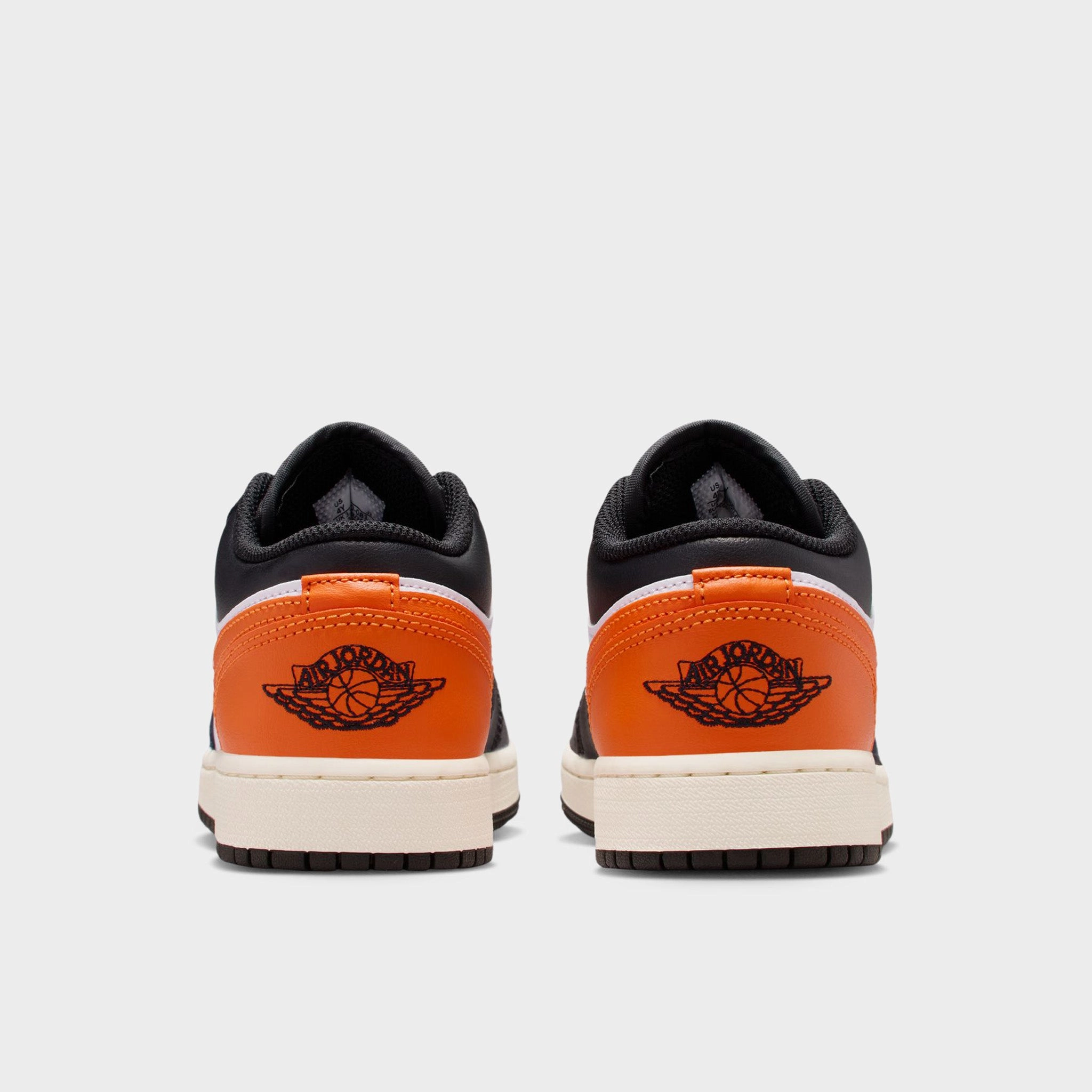 Jordan 1 Low GS Black / Starfish - White Jumping Power Adaptive Traction Pattern