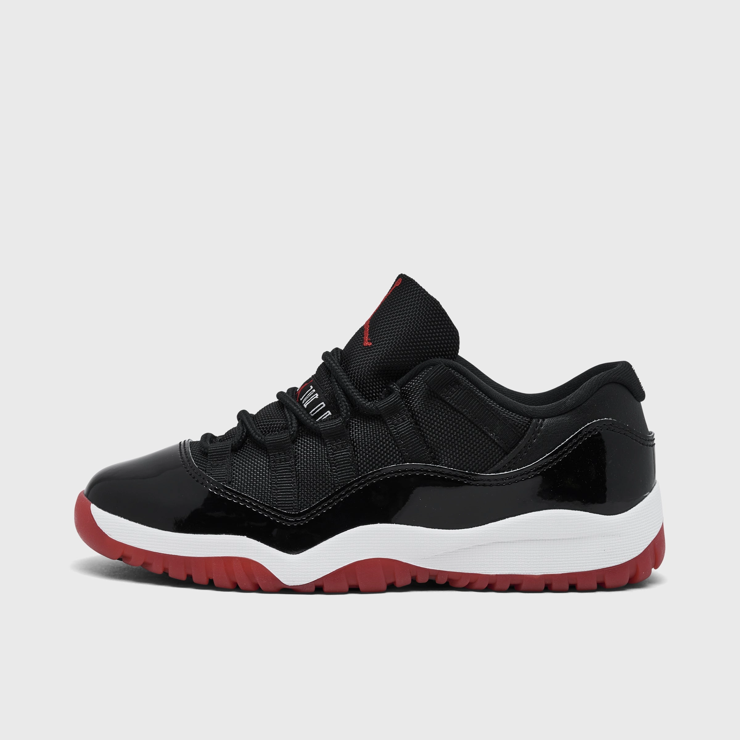 Defensive Power Jordan 11 Retro Low PS Black / Varsity Red - White