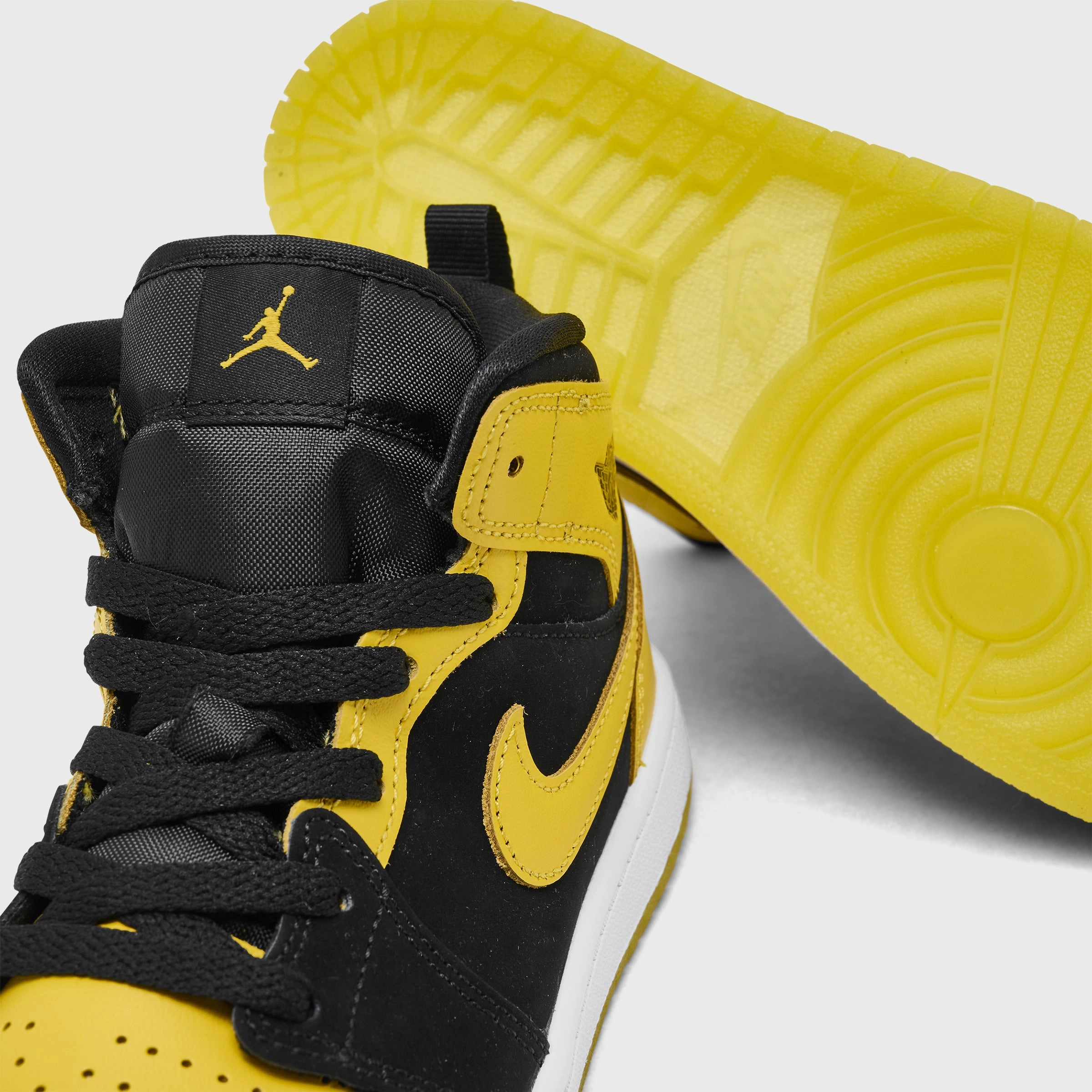 Jordan 1 Mid PS Black / Varsity Maize - White Breathable Airflow Channels