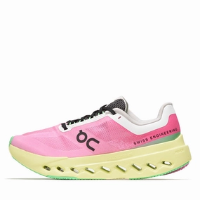 Women's On Cloudsurfer Next - Pink/Limelight running in a mud pot area shoes