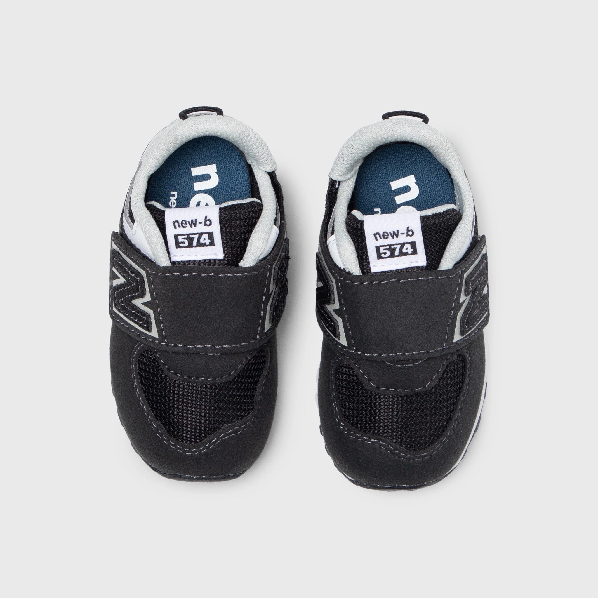 New Balance Infants' 574 Black / White trail durability running in a cross - country meet shoes