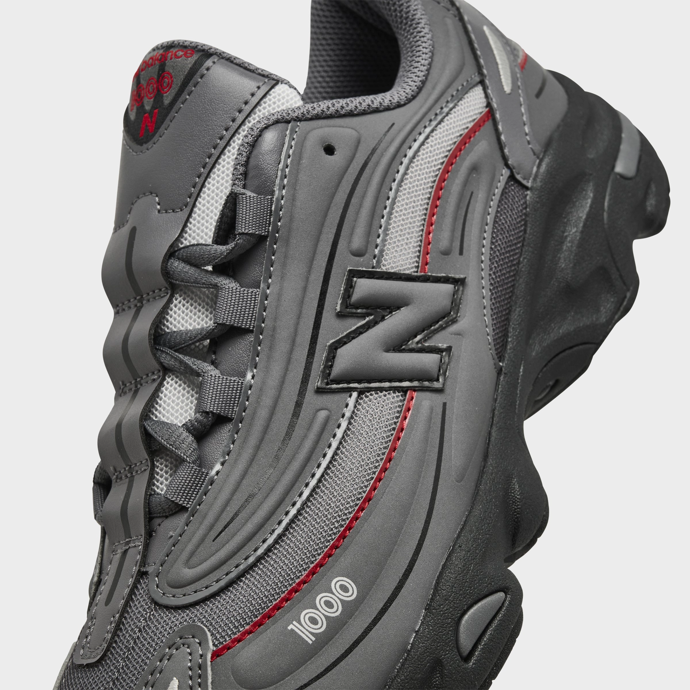 fashion - forward running shoes New Balance Juniors' 1000 Castlerock / Team Red