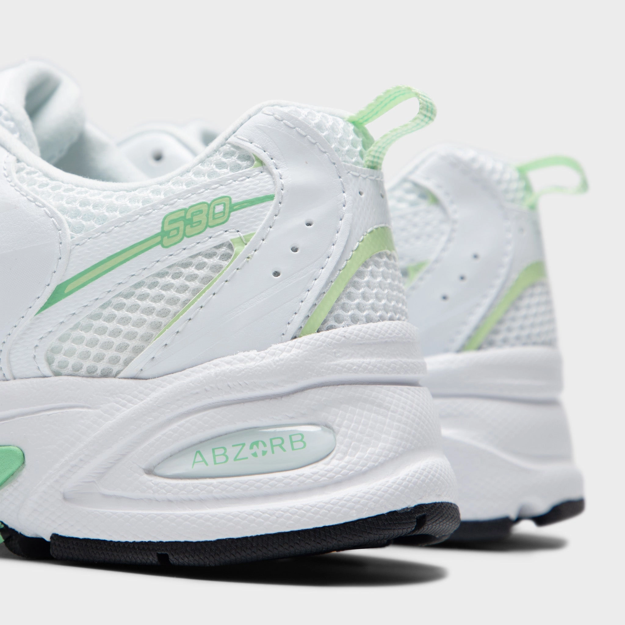 college - team - themed running shoes New Balance Juniors' 530 White / Melon Water