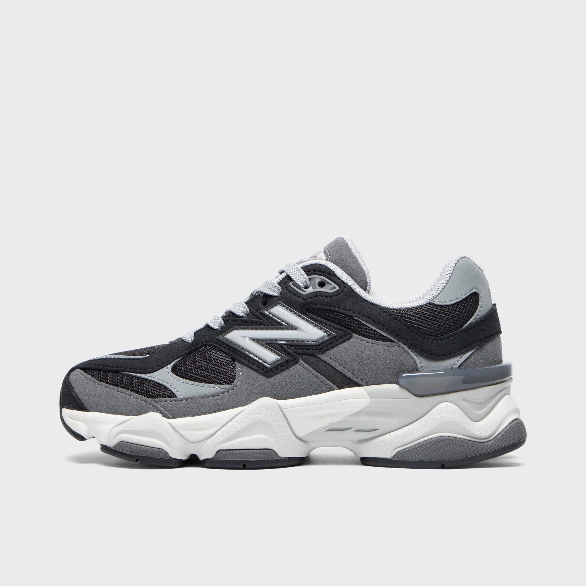 running in a seagrass meadow area shoes running with watch shoes New Balance Juniors' 9060 Black / Castlerock
