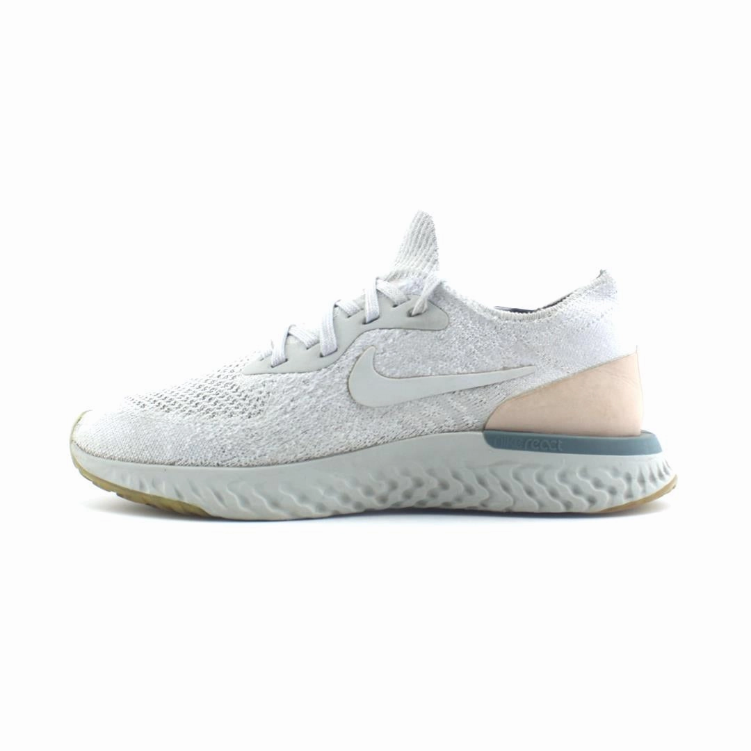 NIKE EPIC REACT FLYKNIT running in a community park shoes